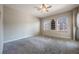 Bright bedroom featuring carpet flooring and a ceiling fan at 424 Luna Bella Ln # 332, New Smyrna Beach, FL 32168