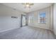 Spacious bedroom with carpet floors and access to balcony at 424 Luna Bella Ln # 332, New Smyrna Beach, FL 32168