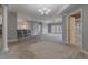 Open concept dining area with a glass table and modern chandelier at 424 Luna Bella Ln # 332, New Smyrna Beach, FL 32168
