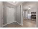 Apartment entryway with white door and view into kitchen at 424 Luna Bella Ln # 332, New Smyrna Beach, FL 32168