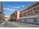 Exterior of the condo building with parking area at 424 Luna Bella Ln # 332, New Smyrna Beach, FL 32168