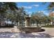 Ornate stone fountain in a landscaped courtyard at 424 Luna Bella Ln # 332, New Smyrna Beach, FL 32168