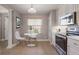 Eat-in kitchen with white table and chairs, and stainless steel appliances at 424 Luna Bella Ln # 332, New Smyrna Beach, FL 32168