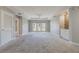 Spacious living room with high ceilings and access to a balcony at 424 Luna Bella Ln # 332, New Smyrna Beach, FL 32168
