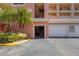 Parking garage with attached building and landscaping at 424 Luna Bella Ln # 332, New Smyrna Beach, FL 32168