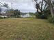 Large grassy backyard with mature trees at 432 Sauls St, Ormond Beach, FL 32174