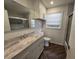 Updated bathroom with walk-in shower at 432 Sauls St, Ormond Beach, FL 32174