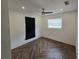 Spacious bedroom with dark herringbone floors and a large window at 432 Sauls St, Ormond Beach, FL 32174
