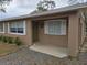 Inviting front porch with a green door at 432 Sauls St, Ormond Beach, FL 32174