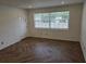 Bright living room with herringbone floors at 432 Sauls St, Ormond Beach, FL 32174
