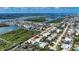 Stunning aerial view highlighting waterfront neighborhood, lush greenery, pool, and serene setting at 4365 S Peninsula Dr, Ponce Inlet, FL 32127