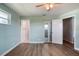 Bright bedroom with neutral walls and doorway to a bathroom at 4365 S Peninsula Dr, Ponce Inlet, FL 32127