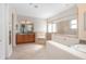 Primary bathroom with soaking tub, glass shower, and double vanities at 43747 Choctaw St, Deland, FL 32720
