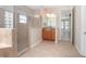 Bathroom with walk-in shower, single vanity and view of bedroom at 43747 Choctaw St, Deland, FL 32720