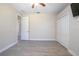 Bright bedroom with laminate floors, ceiling fan, and a closet at 43747 Choctaw St, Deland, FL 32720
