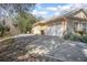 Long driveway leading to a two-car garage and ample parking space at 43747 Choctaw St, Deland, FL 32720