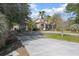House exterior with circular driveway and landscaping at 43747 Choctaw St, Deland, FL 32720