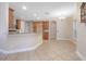 Open kitchen with island, wood cabinets, granite countertops, and stainless steel appliances at 43747 Choctaw St, Deland, FL 32720