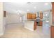 Open concept kitchen with stainless steel appliances, breakfast bar, and tiled floors at 43747 Choctaw St, Deland, FL 32720