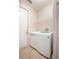 Bright laundry room with washer, dryer, and ample shelving at 43747 Choctaw St, Deland, FL 32720