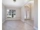 Bright living room with tile floors and a large window at 43747 Choctaw St, Deland, FL 32720