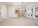 Open-concept living area with tiled floors and views of the kitchen and outdoor space at 43747 Choctaw St, Deland, FL 32720