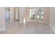 Living area with tile floor and access to entryway at 43747 Choctaw St, Deland, FL 32720