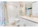 Coastal-themed bathroom with a shower-tub combo, decorated with starfish accents and light, beachy colors at 4672 Riverwalk Village # 8406, Ponce Inlet, FL 32127