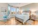 Relaxing bedroom with a bay window offering beautiful views, complemented by coastal-themed decor and furnishings at 4672 Riverwalk Village # 8406, Ponce Inlet, FL 32127