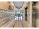 Elegant building lobby with mailboxes, elevators, and a view to the exterior at 4672 Riverwalk Village # 8406, Ponce Inlet, FL 32127
