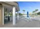 Community pool area with outdoor kitchen, seating, and lounge chairs, perfect for relaxation at 4672 Riverwalk Village # 8406, Ponce Inlet, FL 32127