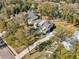 Aerial view of a gray house in a residential neighborhood at 475 W Main St, Lake Helen, FL 32744