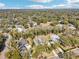 Aerial view of a neighborhood with several houses, highlighting the community's landscape and layout at 475 W Main St, Lake Helen, FL 32744