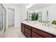 Bathroom features double vanity, walk-in shower, soaking tub, and plenty of counter space at 475 W Main St, Lake Helen, FL 32744