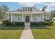 Charming single-story home with a welcoming front porch and well-maintained landscaping at 475 W Main St, Lake Helen, FL 32744