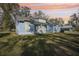 Light blue house exterior with a large yard and attached garage at 475 W Main St, Lake Helen, FL 32744