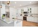 Modern kitchen with granite countertops, stainless steel appliances, and ample cabinet space at 475 W Main St, Lake Helen, FL 32744