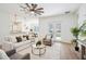 Spacious open-concept living area with access to the kitchen and outdoor patio at 475 W Main St, Lake Helen, FL 32744