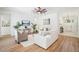 Open living room with hardwood floors, comfy sofas, and neutral decor at 475 W Main St, Lake Helen, FL 32744