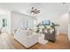 Bright living area with neutral decor, wood floors, and access to the outdoor area at 475 W Main St, Lake Helen, FL 32744