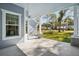 Covered patio with ceiling fan and brick columns offering views of a grassy backyard at 475 W Main St, Lake Helen, FL 32744