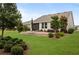 Landscaped backyard with patio and screened porch at 5589 Nw 40Th Loop, Ocala, FL 34482