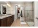 Elegant bathroom features a double vanity, walk-in shower, and access to a large closet at 5589 Nw 40Th Loop, Ocala, FL 34482