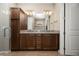 Bathroom boasts double sinks, granite countertop, and modern wood cabinets at 5589 Nw 40Th Loop, Ocala, FL 34482