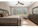 Bright bedroom with king-size bed and large windows at 5589 Nw 40Th Loop, Ocala, FL 34482