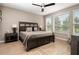 Spacious bedroom with a king-size bed and ceiling fan at 5589 Nw 40Th Loop, Ocala, FL 34482