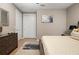 Spacious bedroom with large bed, dresser, and access to closet at 5589 Nw 40Th Loop, Ocala, FL 34482