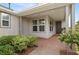 Inviting front porch with brick pavers and landscaping at 5589 Nw 40Th Loop, Ocala, FL 34482