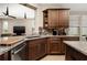 Modern kitchen with wood cabinets and granite countertops at 5589 Nw 40Th Loop, Ocala, FL 34482