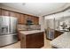 Large kitchen island with granite countertops and stainless steel appliances at 5589 Nw 40Th Loop, Ocala, FL 34482